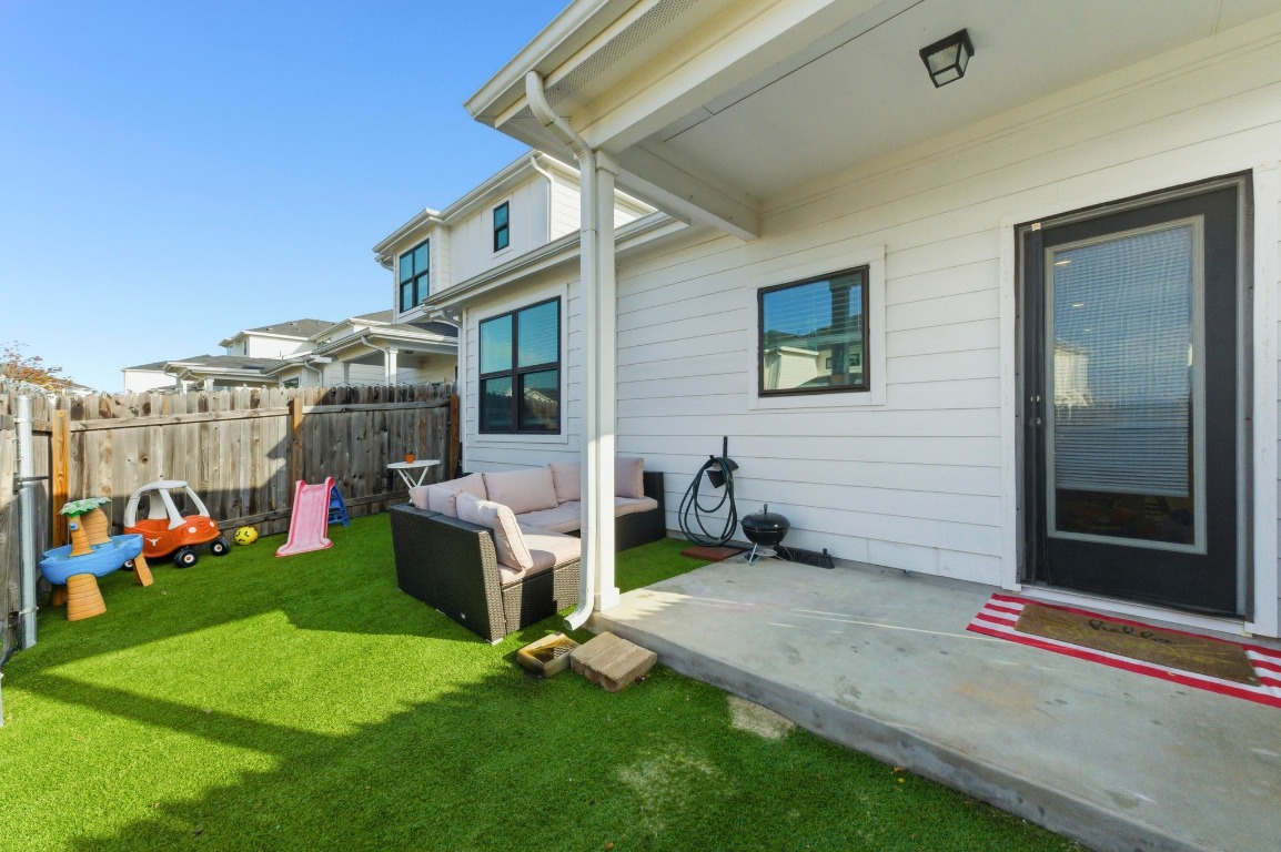 159 Threshing Road, Unit A Buda, TX 78610 - Photo 30 of 33 View of yard featuring a patio and an outdoor living space