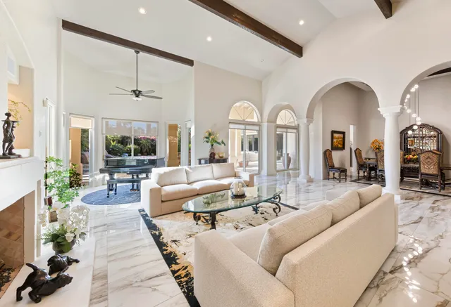 a view of living room with furniture and a potted plant