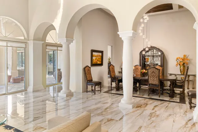a kitchen with granite countertop lots of counter top space and wooden floor