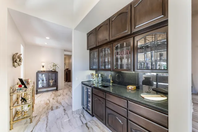 a living room with furniture a rug and a flat screen tv
