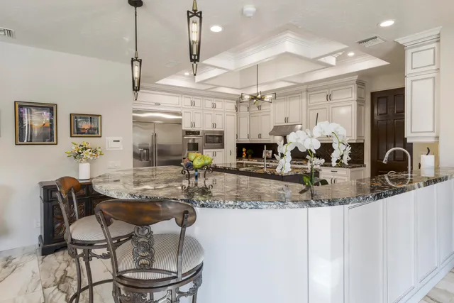 a view of a kitchen and dining room