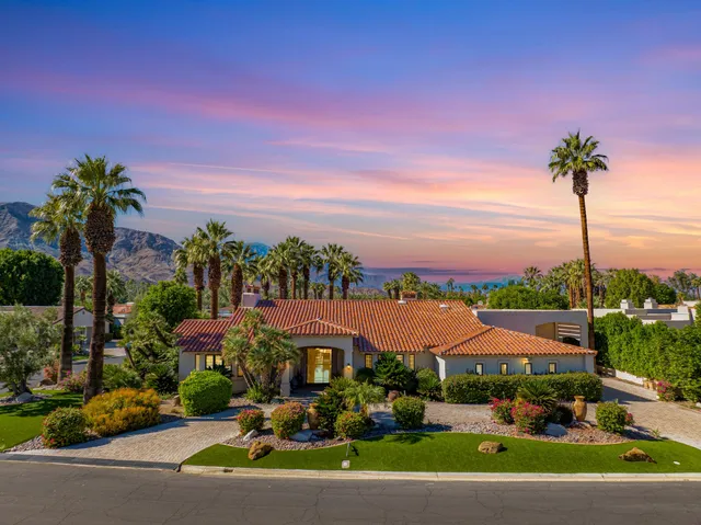 a view of a garden with a houses
