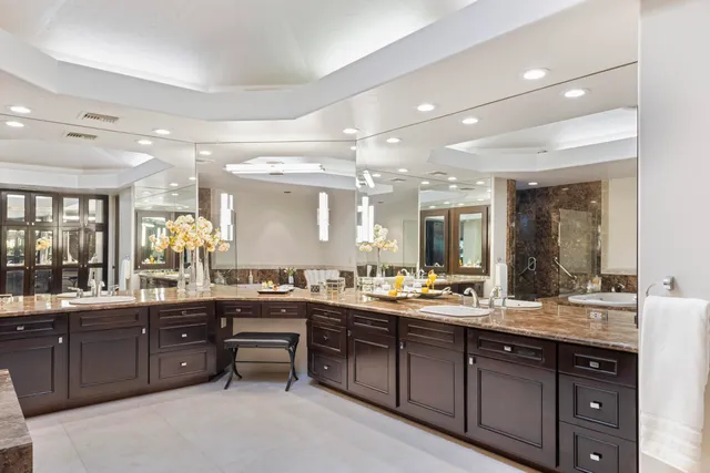 a bathroom with a double vanity sink and a bathtub