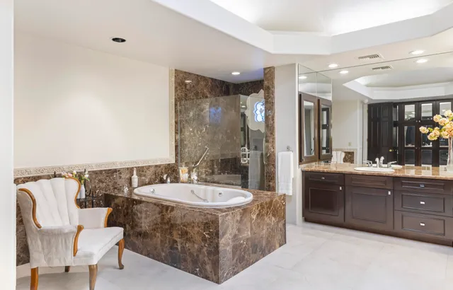 a living room with furniture windows and a rug