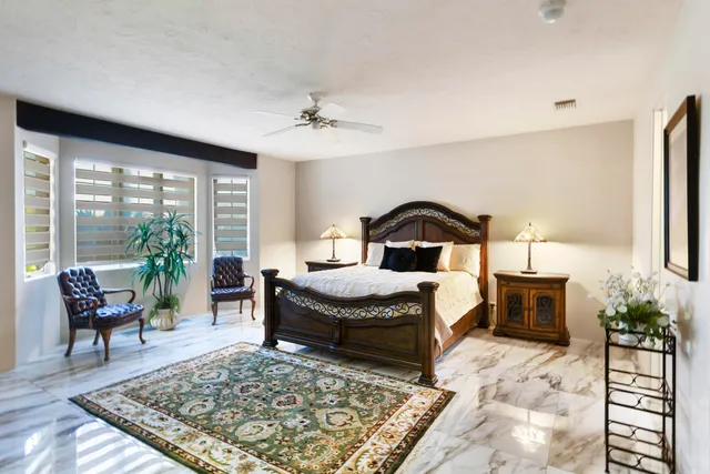 a kitchen with a sink and a mirror