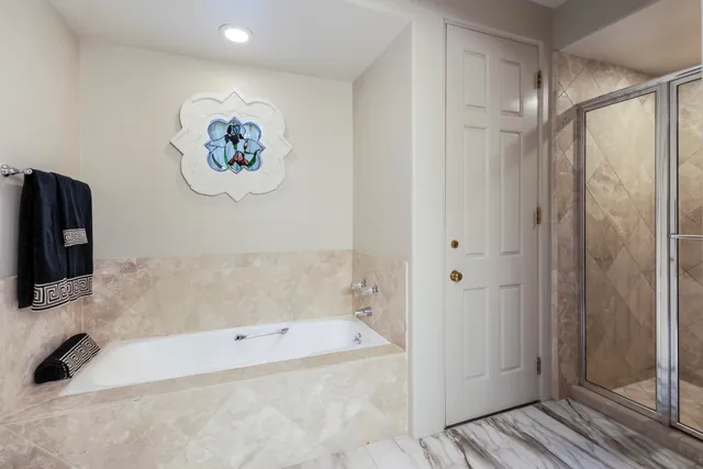 a bedroom with a bed and a chair