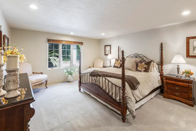 a bathroom with a shower sink and mirror