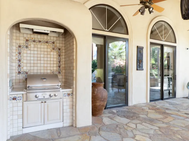a living room with patio furniture