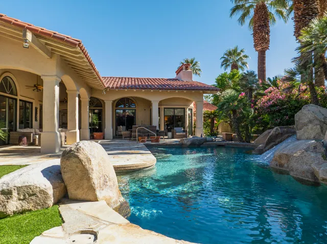 an aerial view of house with a garden