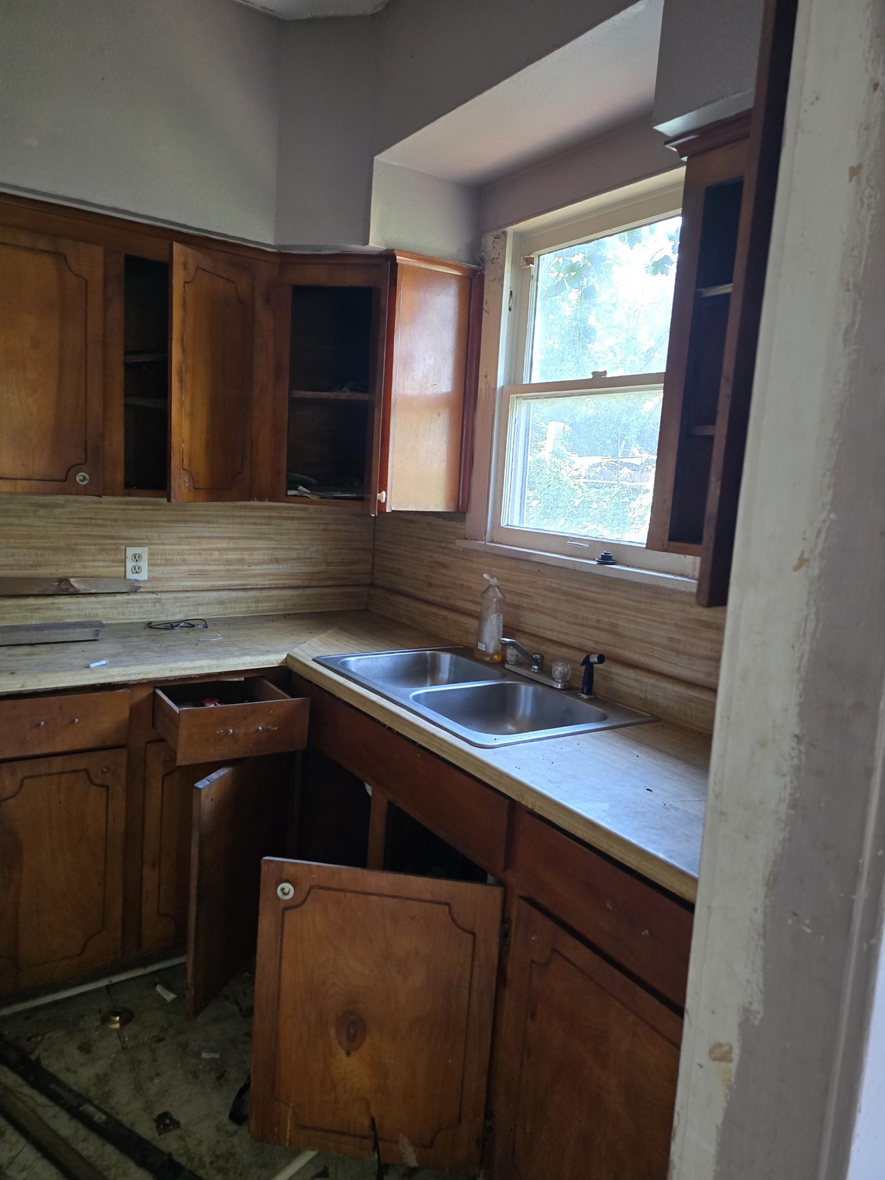 2305 Elysian Street Houston, TX 77026 - Photo 4 of 12 a kitchen with a sink cabinets and window