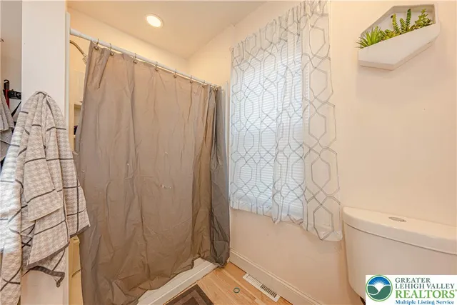 a bathroom with a bathtub and shower