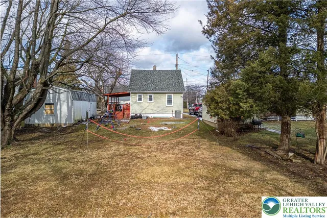a view of road with large trees