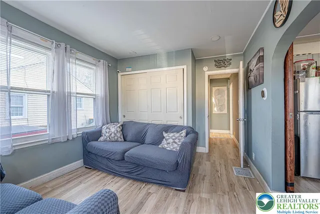 a living room with furniture and a window