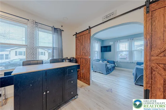 a kitchen with sink refrigerator and window