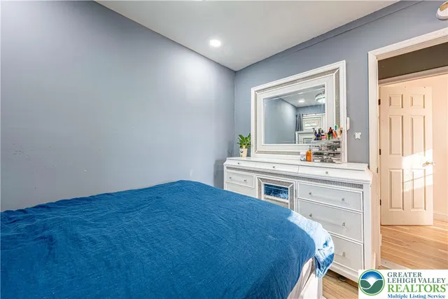 a spacious bathroom with a sink and a mirror