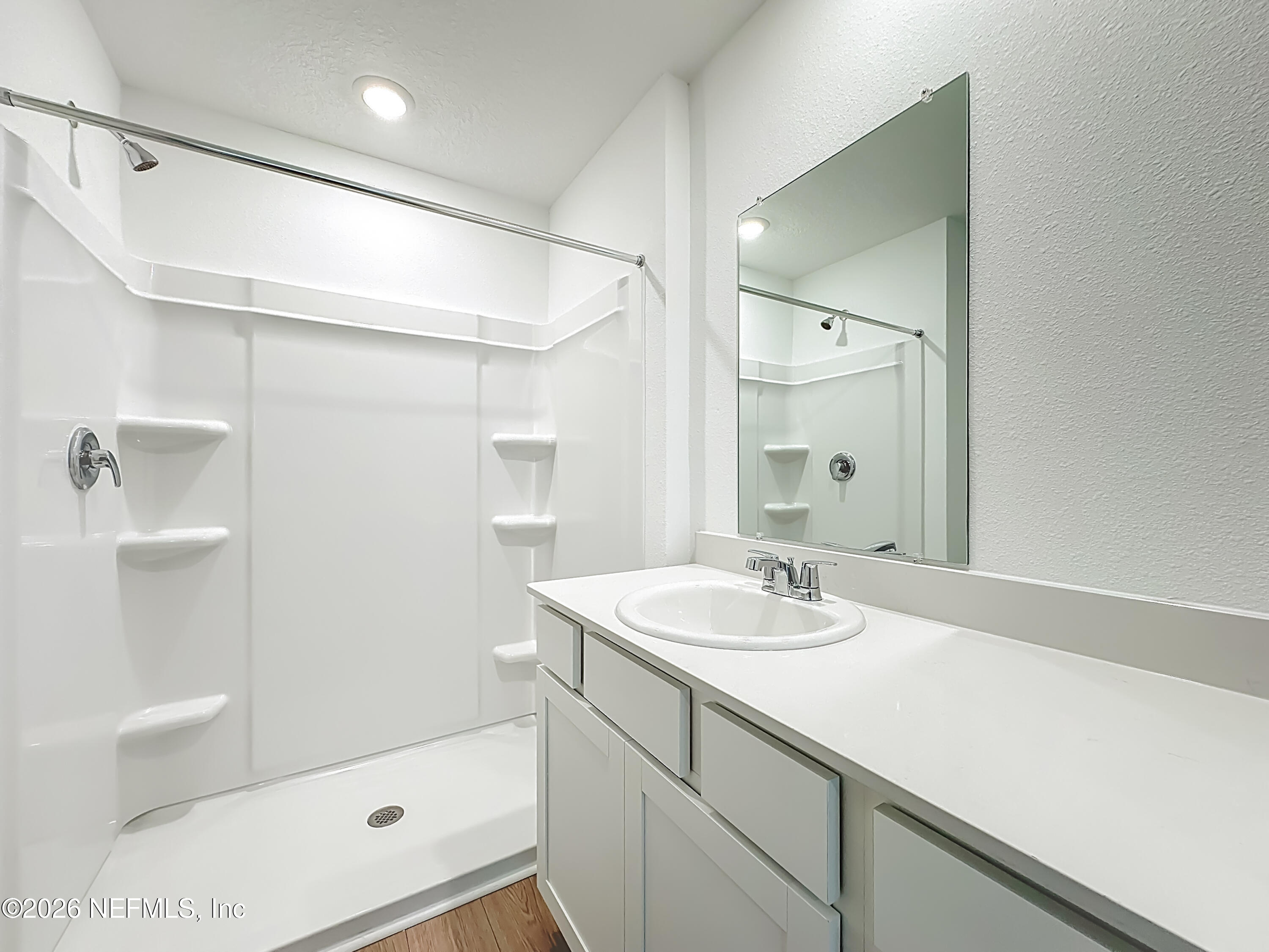 177 Palmetto Rdg Road St. Augustine, FL 32095 - Photo 12 of 19 a bathroom with a sink a shower and a mirror