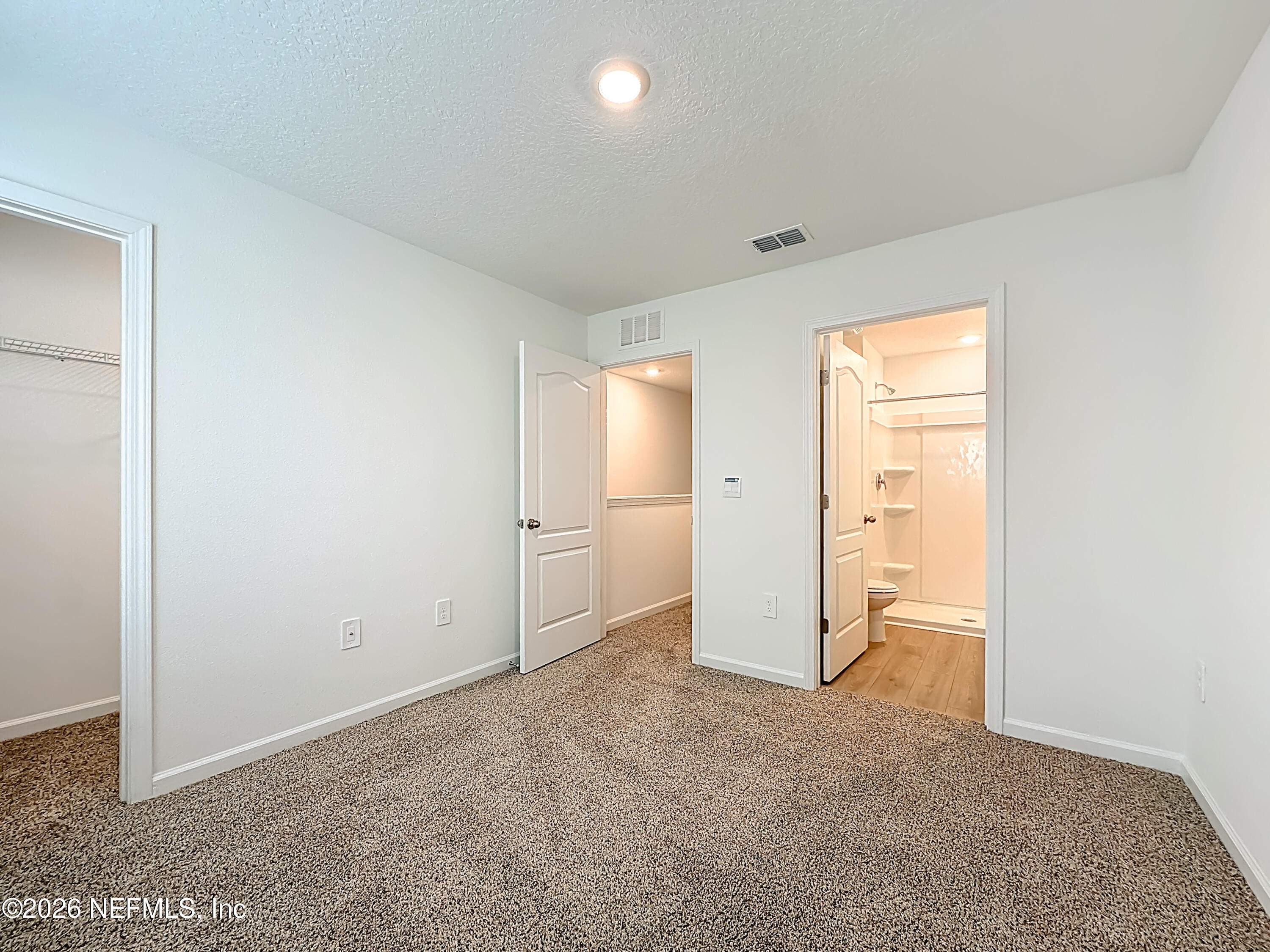 177 Palmetto Rdg Road St. Augustine, FL 32095 - Photo 14 of 19 an empty room with closet and a bathroom