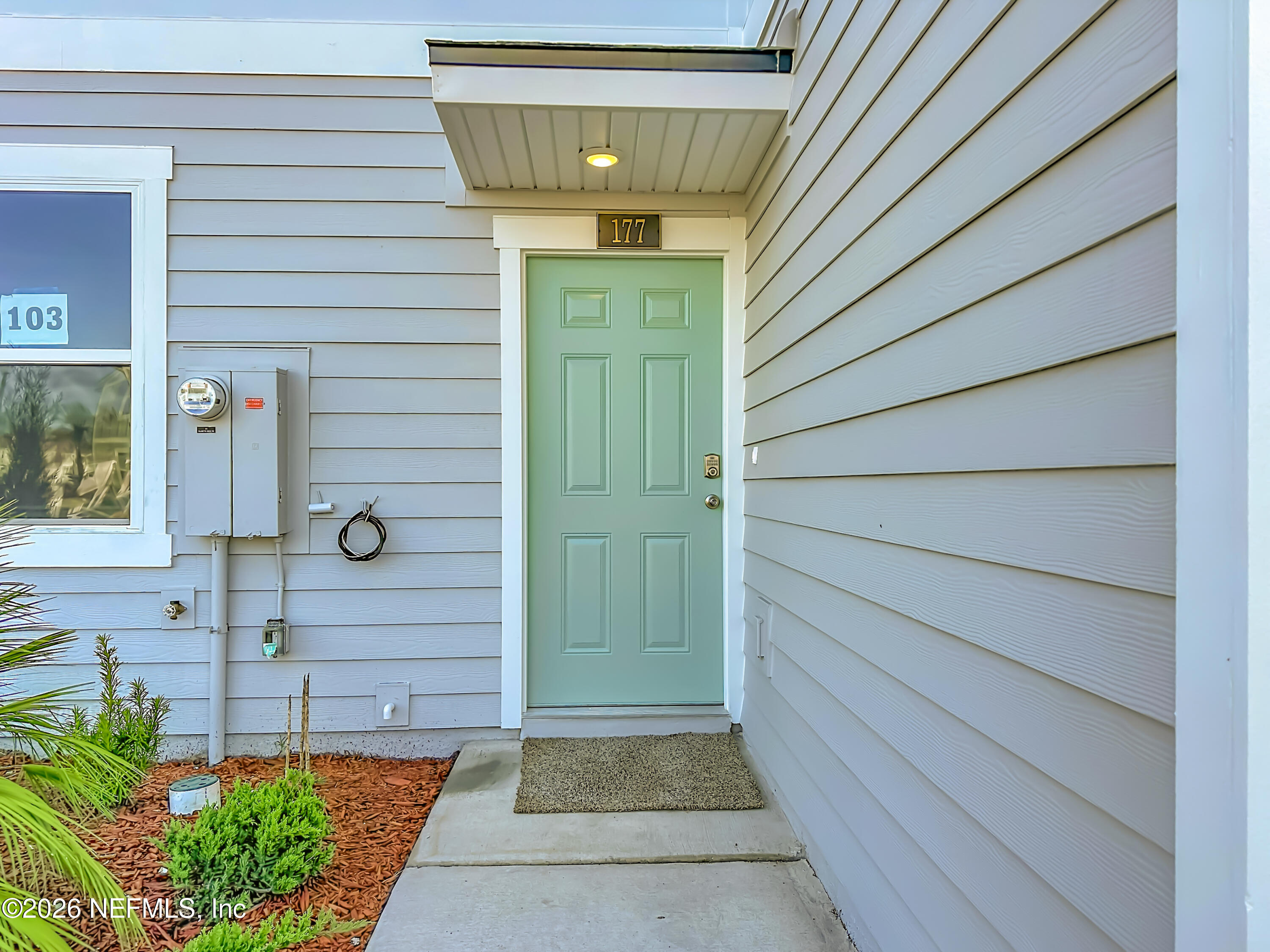 177 Palmetto Rdg Road St. Augustine, FL 32095 - Photo 3 of 19 a front view of a house with a garden