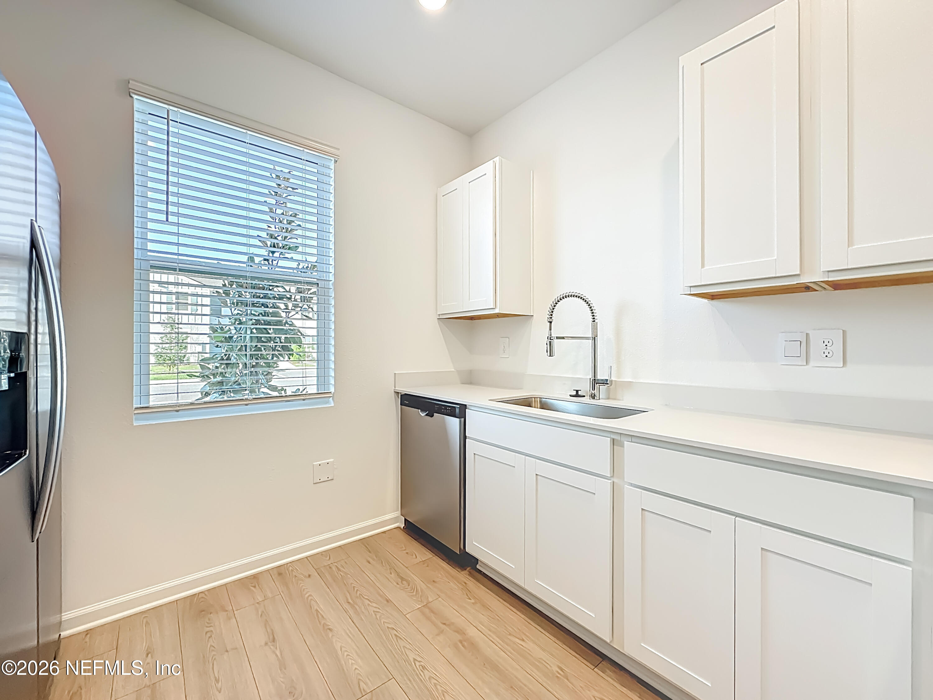 177 Palmetto Rdg Road St. Augustine, FL 32095 - Photo 6 of 19 a kitchen with sink and cabinets