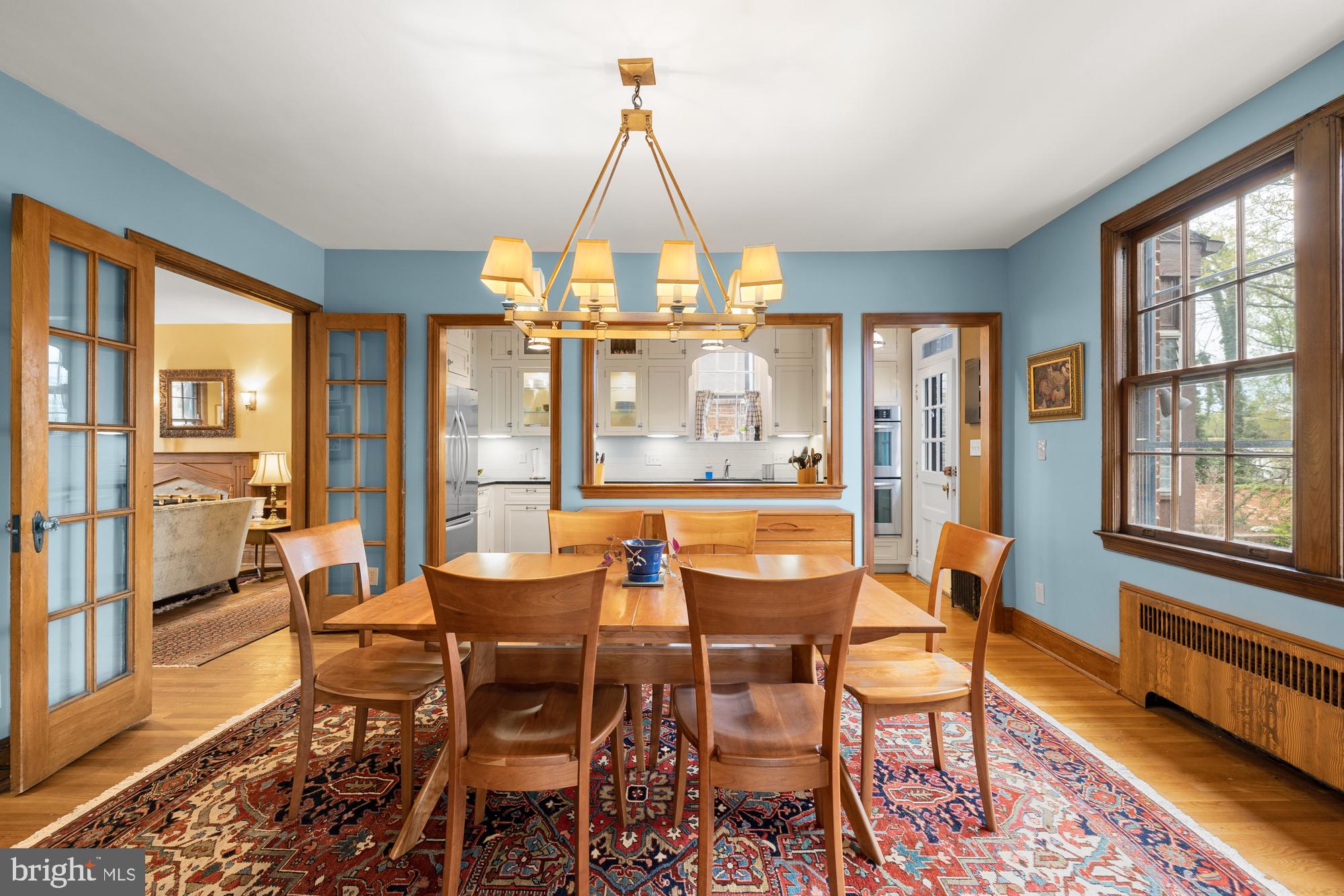 1441 Manchester Lane Northwest Washington, DC 20011 - Photo 11 of 63 a dining room with furniture a chandelier and wooden floor