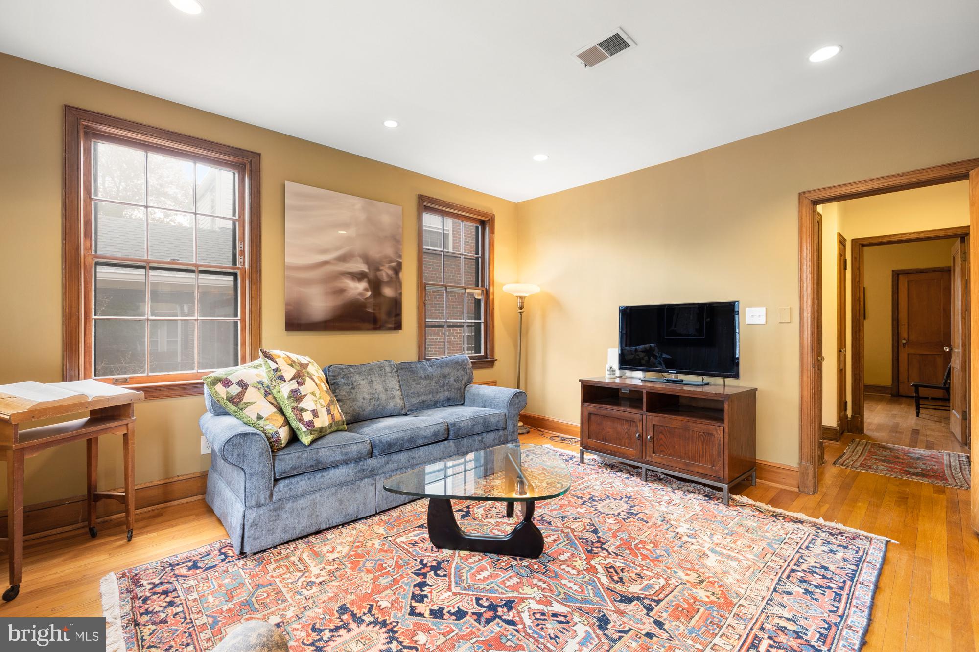 1441 Manchester Lane Northwest Washington, DC 20011 - Photo 19 of 63 a living room with furniture and a flat screen tv