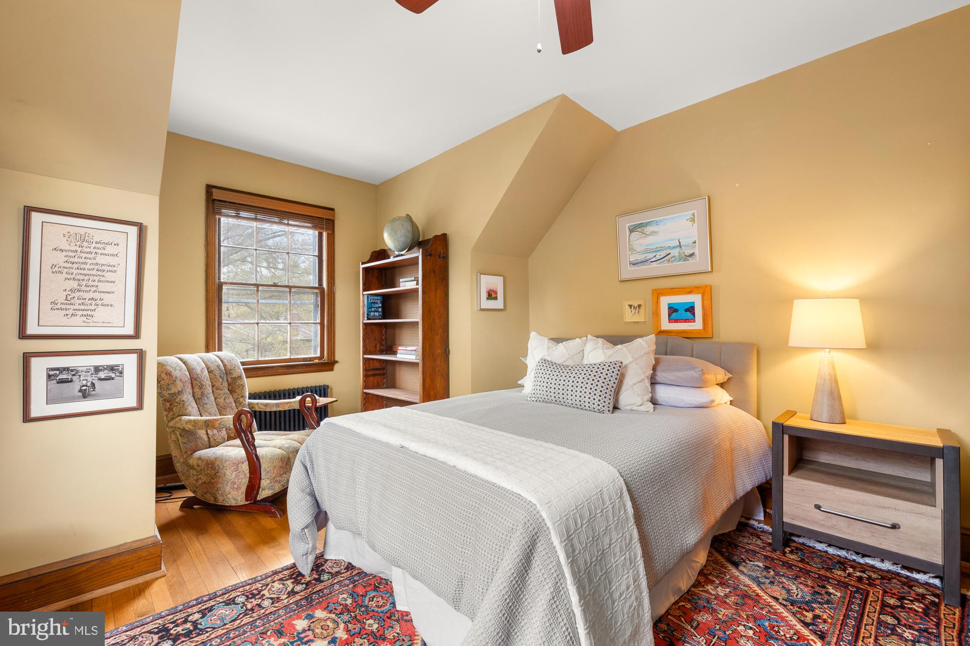 1441 Manchester Lane Northwest Washington, DC 20011 - Photo 26 of 63 a bedroom with a bed and a dresser next to a window