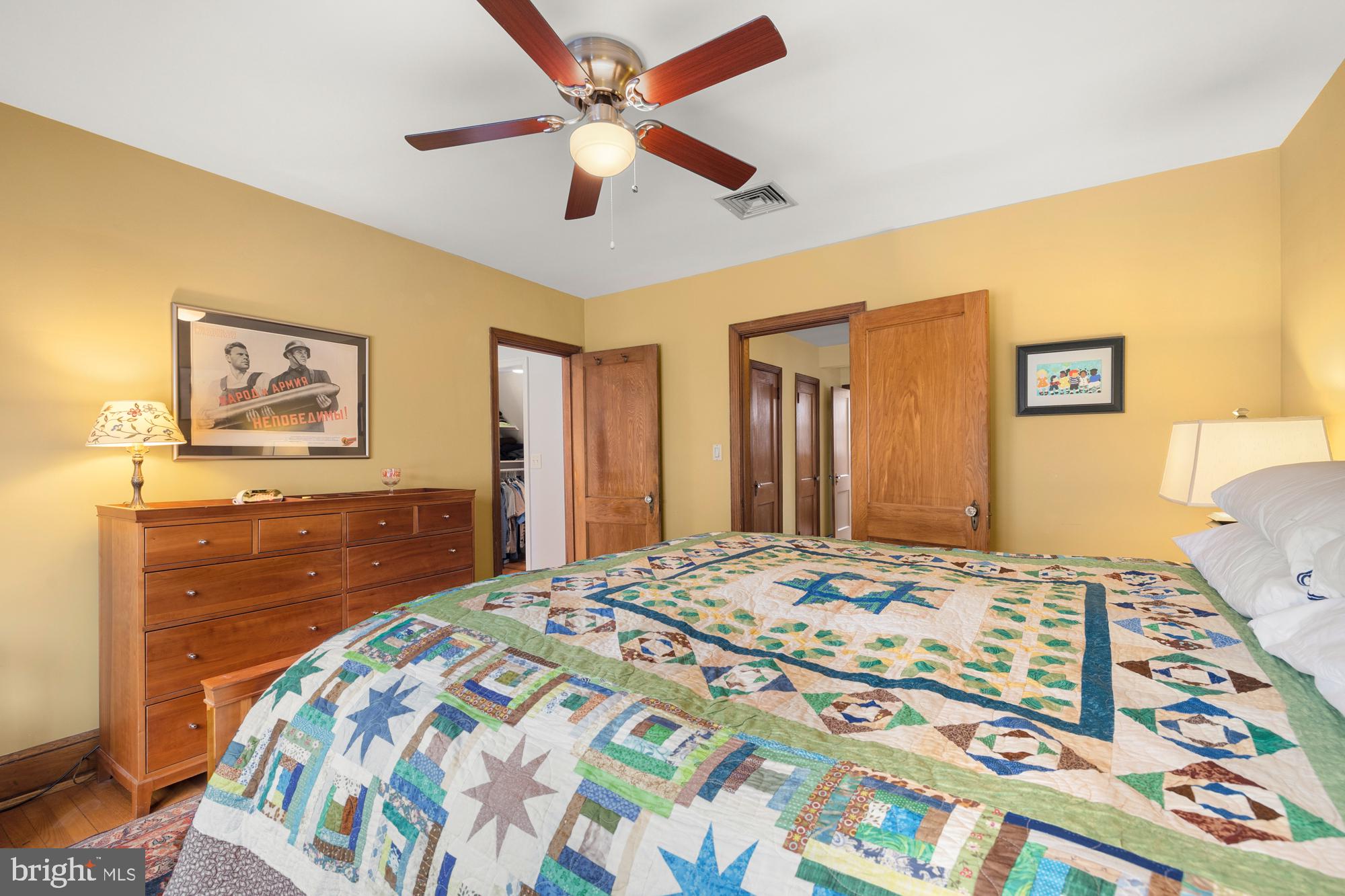 1441 Manchester Lane Northwest Washington, DC 20011 - Photo 34 of 63 a bedroom with a bed and a dresser