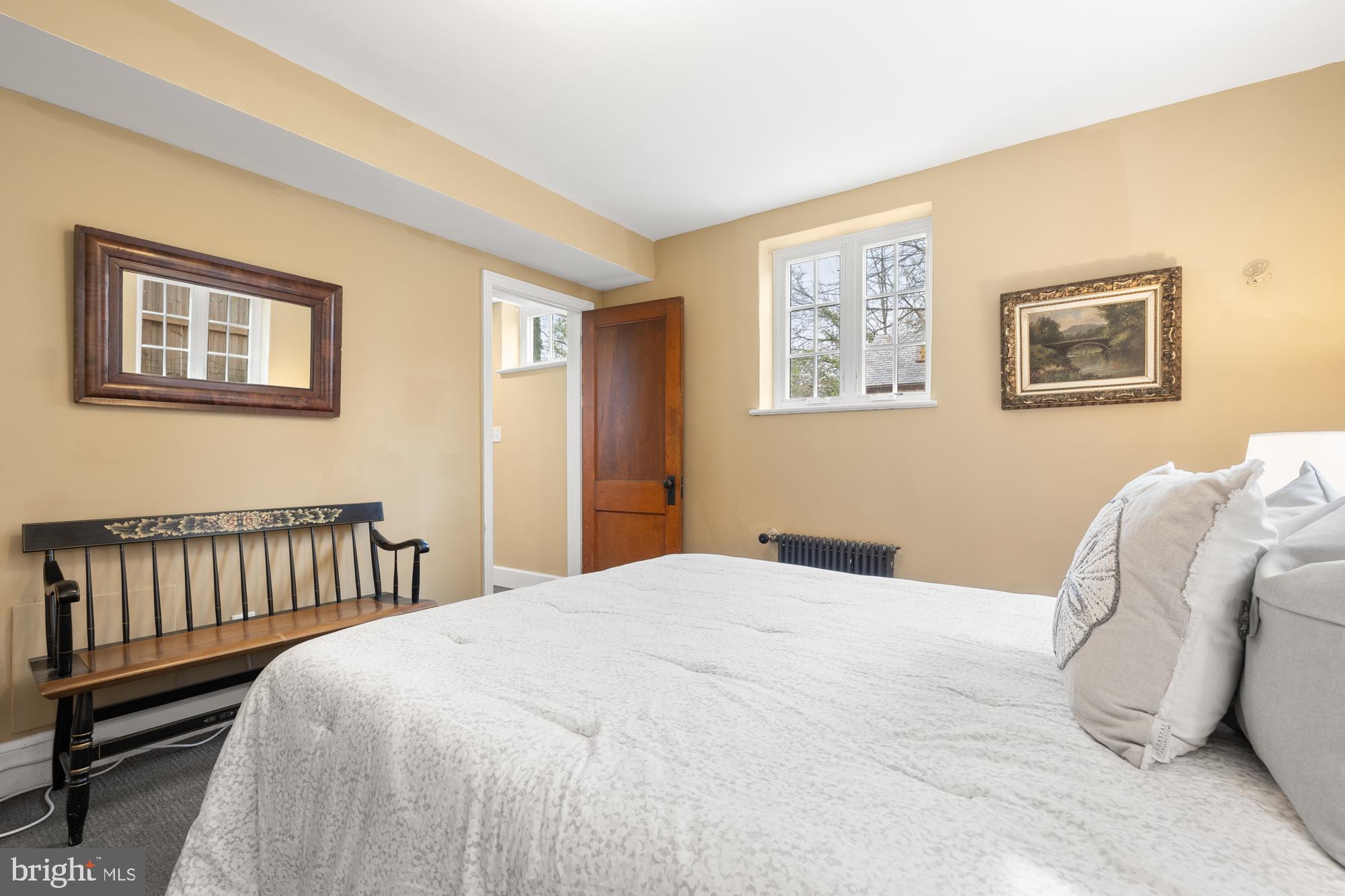1441 Manchester Lane Northwest Washington, DC 20011 - Photo 48 of 63 a bedroom with a bed and a painting on the wall
