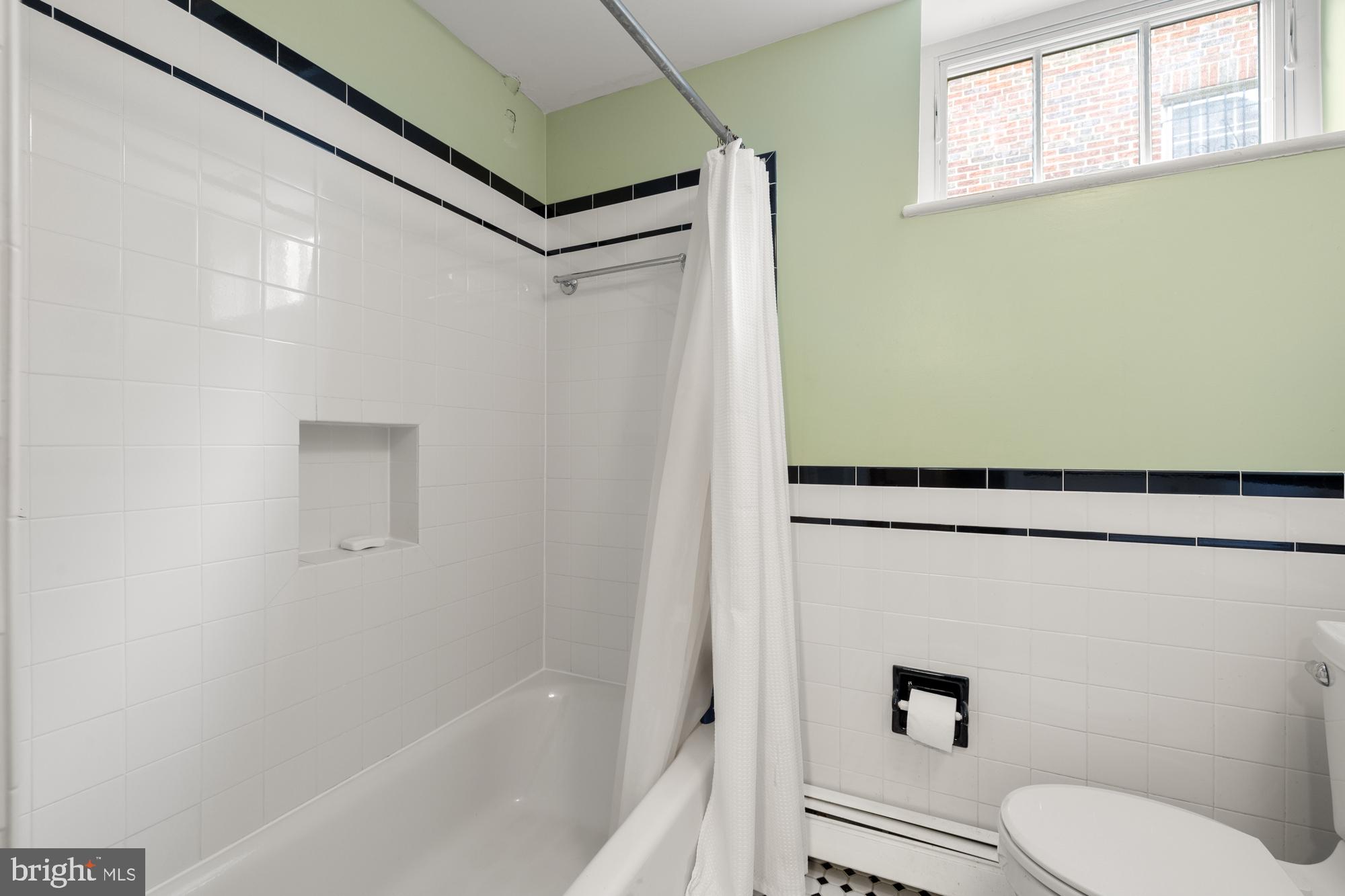 1441 Manchester Lane Northwest Washington, DC 20011 - Photo 50 of 63 a bathroom with a toilet and a bathtub
