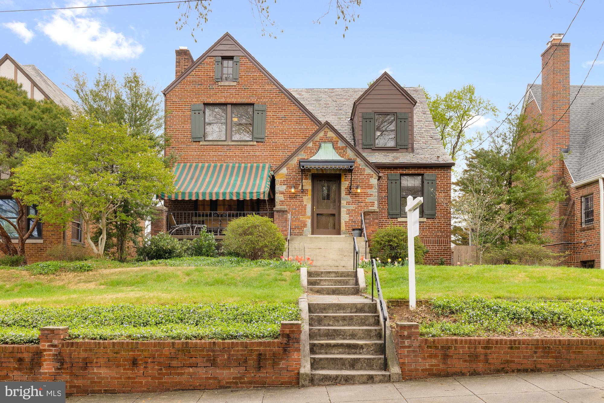 1441 Manchester Lane Northwest Washington, DC 20011 - Photo 59 of 63 a front view of a house with garden