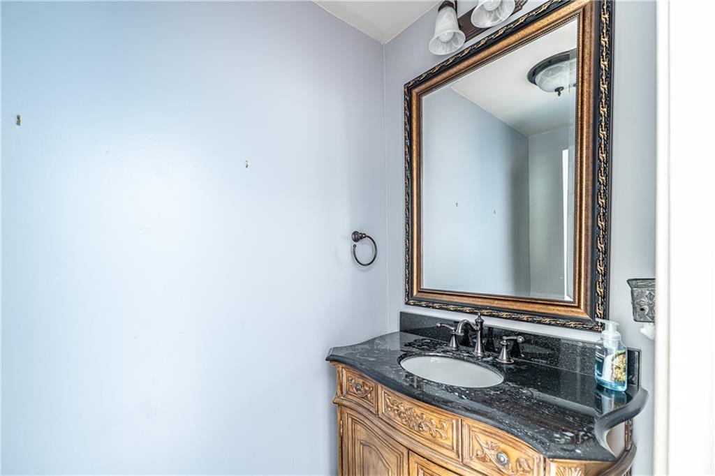 113 Warwick Way Rome, GA 30161 - Photo 18 of 49 a bathroom with a granite countertop sink and a mirror