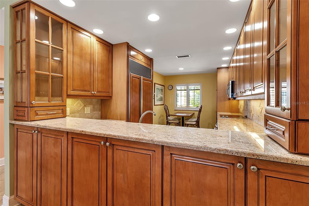 3840 Mariners Way, Unit 514A Cortez, FL 34215 - Photo 11 of 33 a kitchen with stainless steel appliances granite countertop a sink and cabinets
