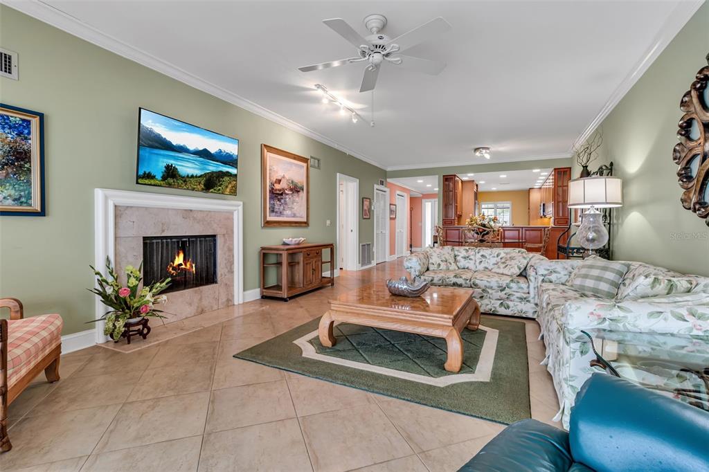3840 Mariners Way, Unit 514A Cortez, FL 34215 - Photo 16 of 33 a living room with furniture and a fireplace