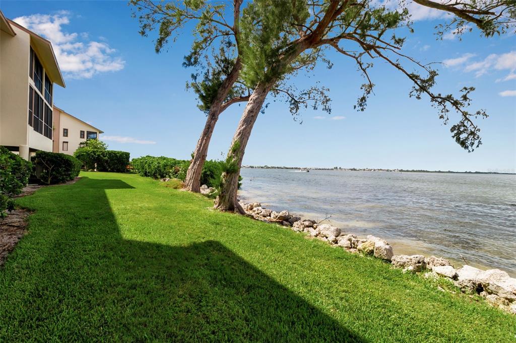 3840 Mariners Way, Unit 514A Cortez, FL 34215 - Photo 19 of 33 a view of a lake with a big yard