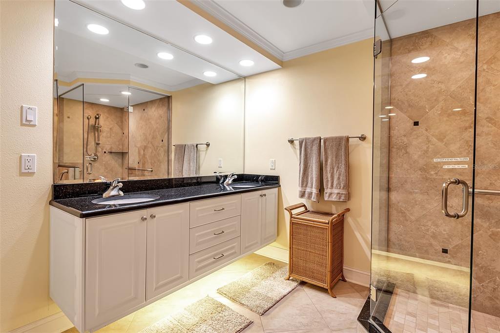 3840 Mariners Way, Unit 514A Cortez, FL 34215 - Photo 21 of 33 a bathroom with a double vanity sink a mirror and a shower