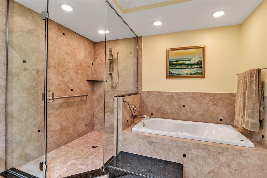 3840 Mariners Way, Unit 514A Cortez, FL 34215 - Photo 22 of 33 a bathroom with a bathtub and a shower