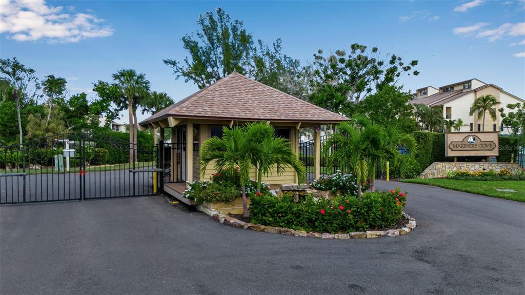 3840 Mariners Way, Unit 514A Cortez, FL 34215 - Photo 33 of 33 a backyard of a house with lots of green space