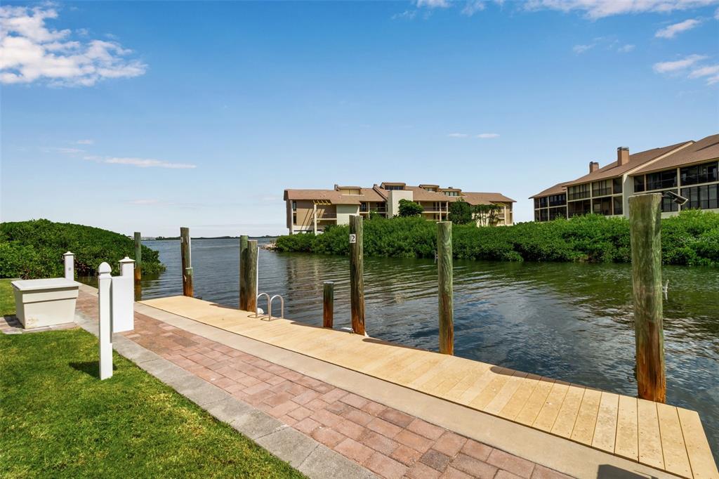 3840 Mariners Way, Unit 514A Cortez, FL 34215 - Photo 4 of 33 a balcony view with a garden