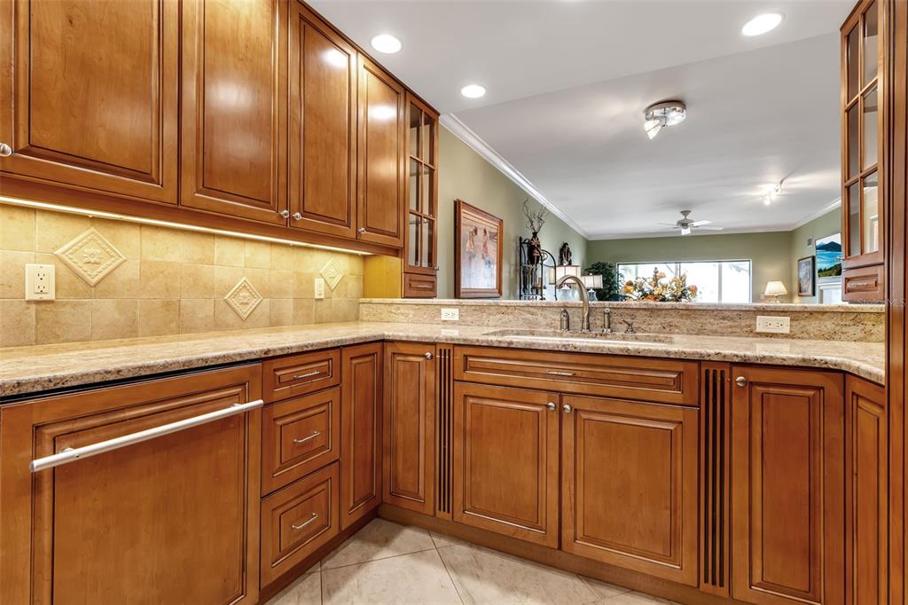3840 Mariners Way, Unit 514A Cortez, FL 34215 - Photo 10 of 33 a kitchen with granite countertop cabinets stainless steel appliances and a counter space