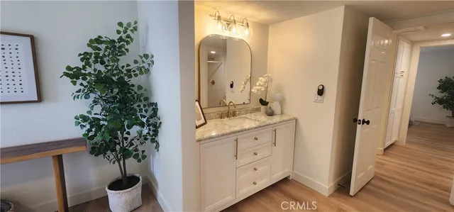 a bathroom with a sink and mirror
