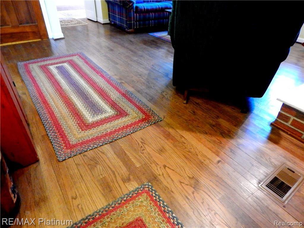 86 South Burkhart Road Howell, MI 48843 - Photo 22 of 52 Rich Oak Hardwood floors grace the family room, den, and hall.