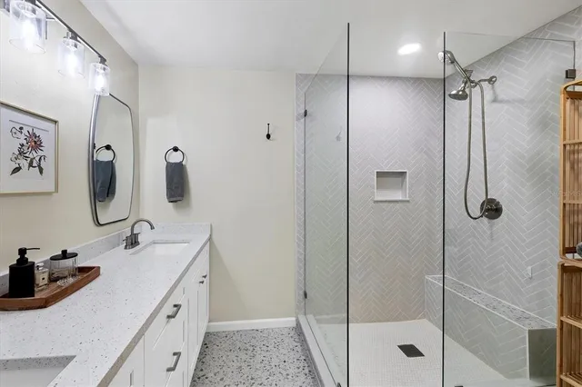a bathroom with a sink and mirror