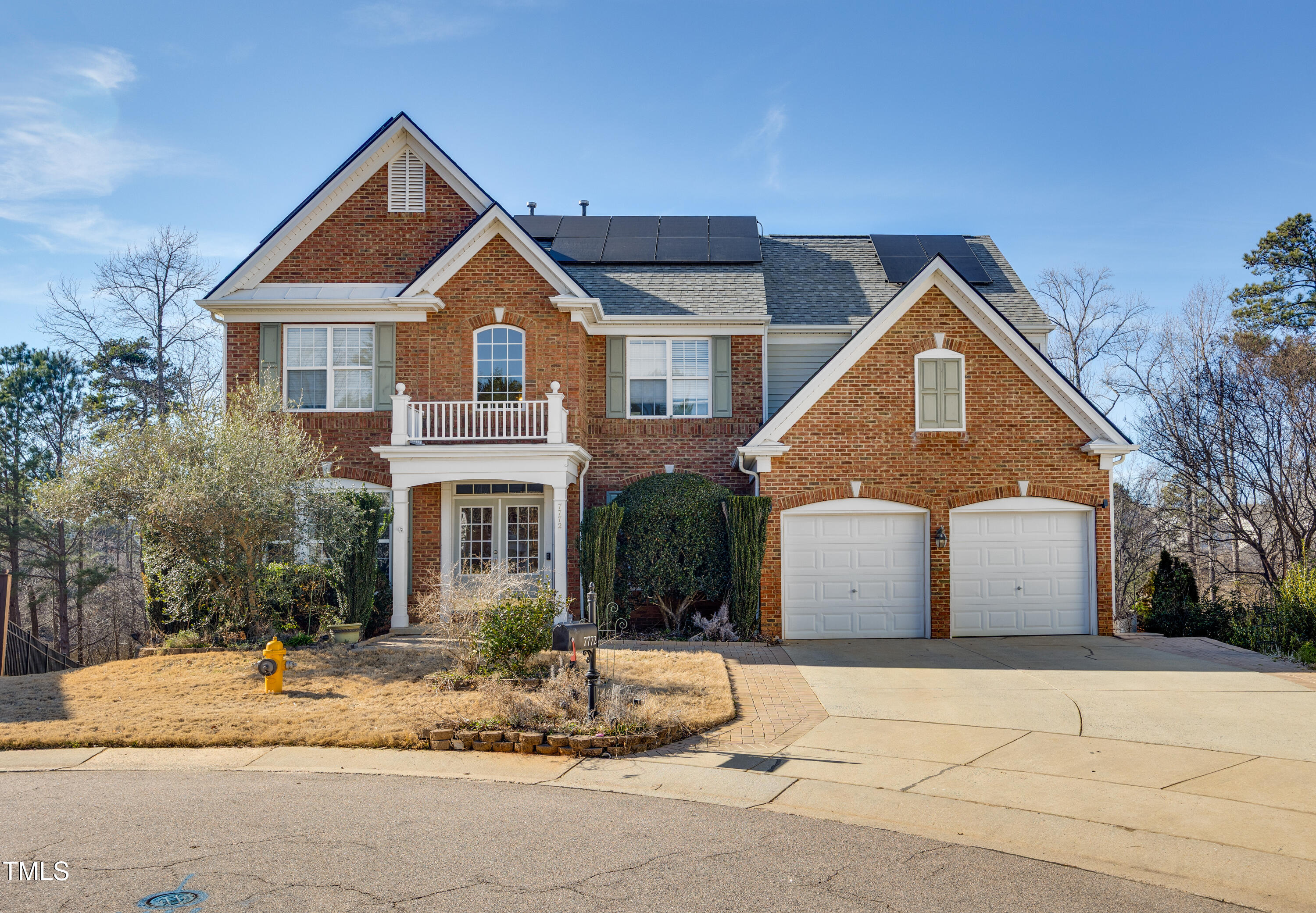 7772 Silver View Lane Raleigh, NC 27613 - Photo 1 of 55 a front view of a house with a yard