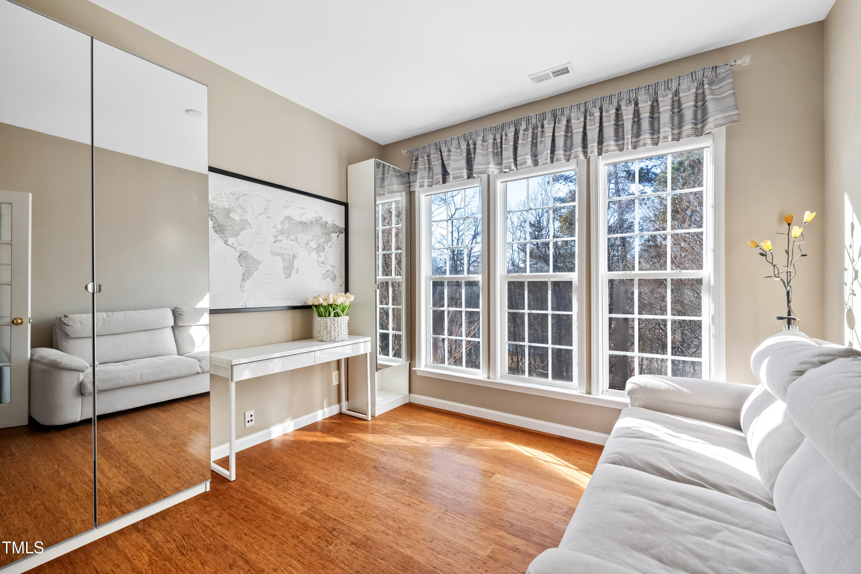 7772 Silver View Lane Raleigh, NC 27613 - Photo 15 of 55 a living room with furniture and a large window