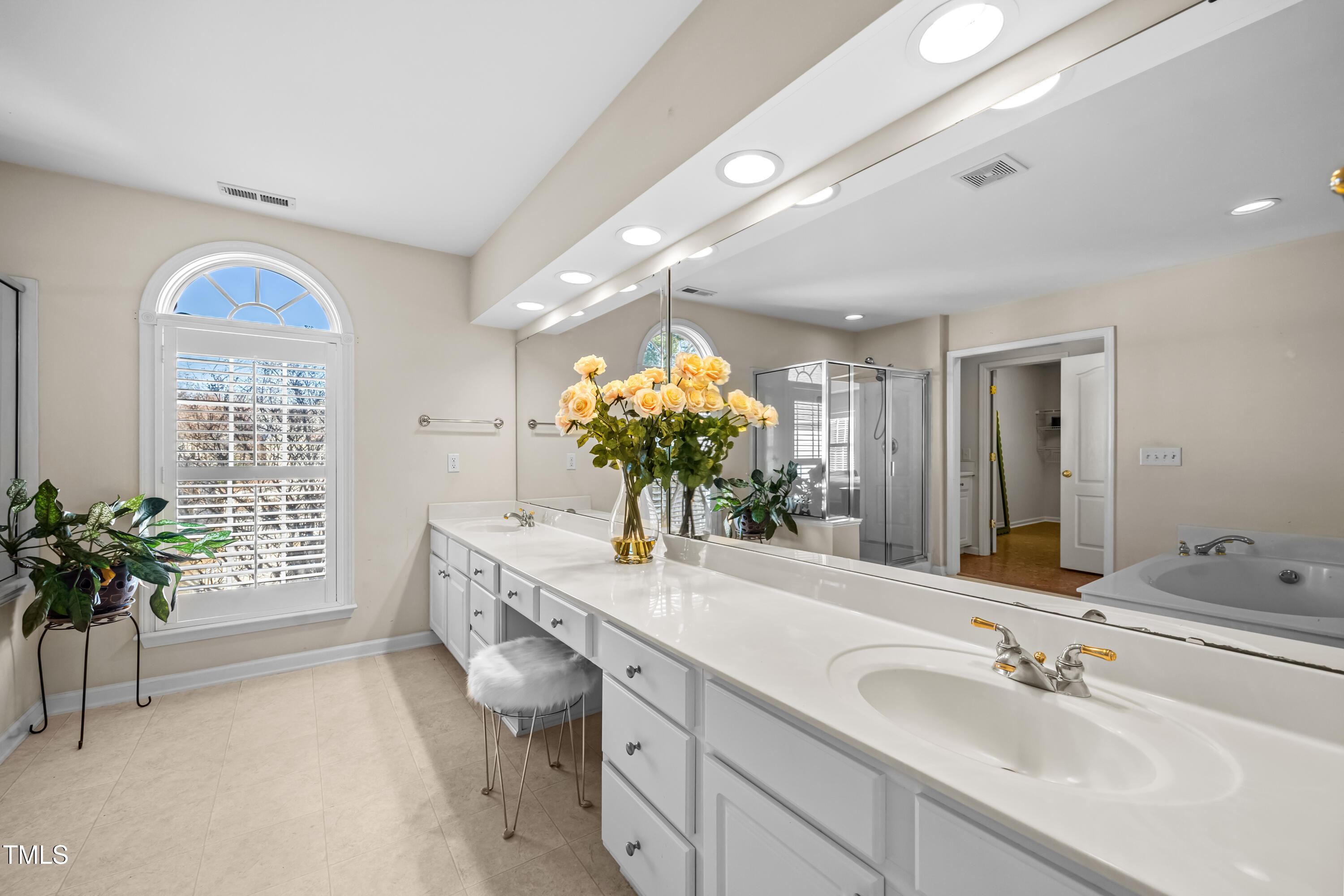 7772 Silver View Lane Raleigh, NC 27613 - Photo 20 of 55 a bathroom with a sink and a mirror