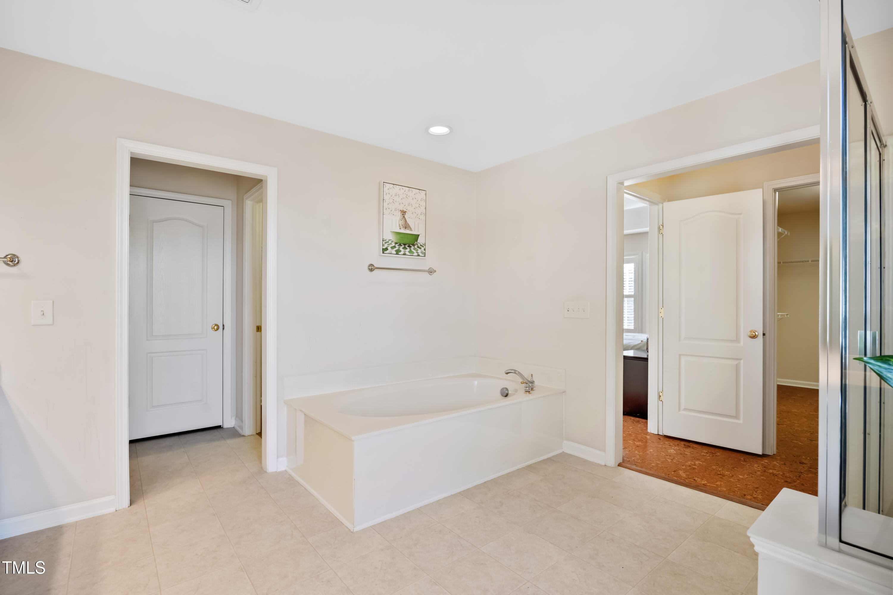 7772 Silver View Lane Raleigh, NC 27613 - Photo 22 of 55 a spacious bathroom with a bathtub and a shower