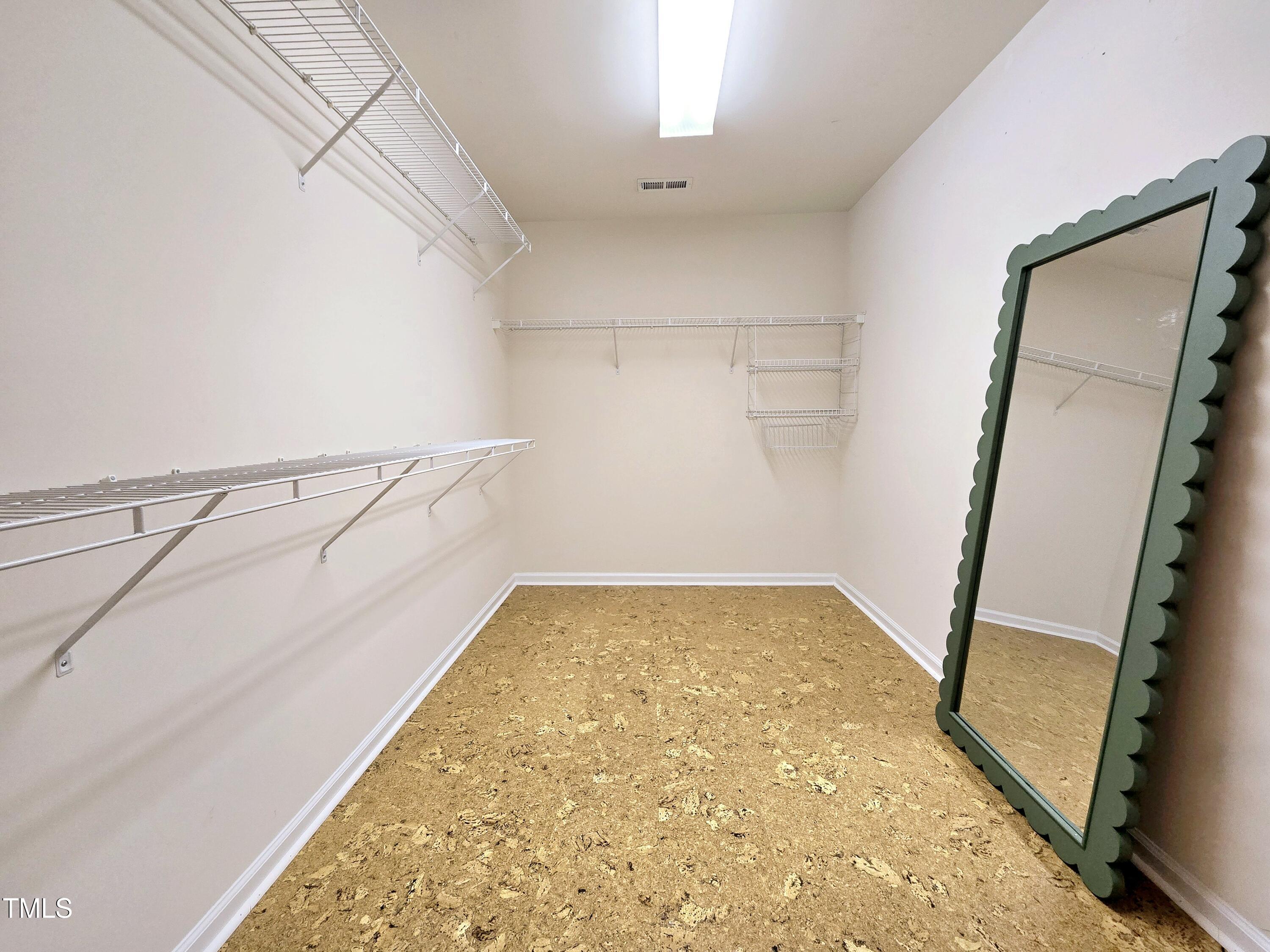 7772 Silver View Lane Raleigh, NC 27613 - Photo 23 of 55 a view of a room with racks on the wall