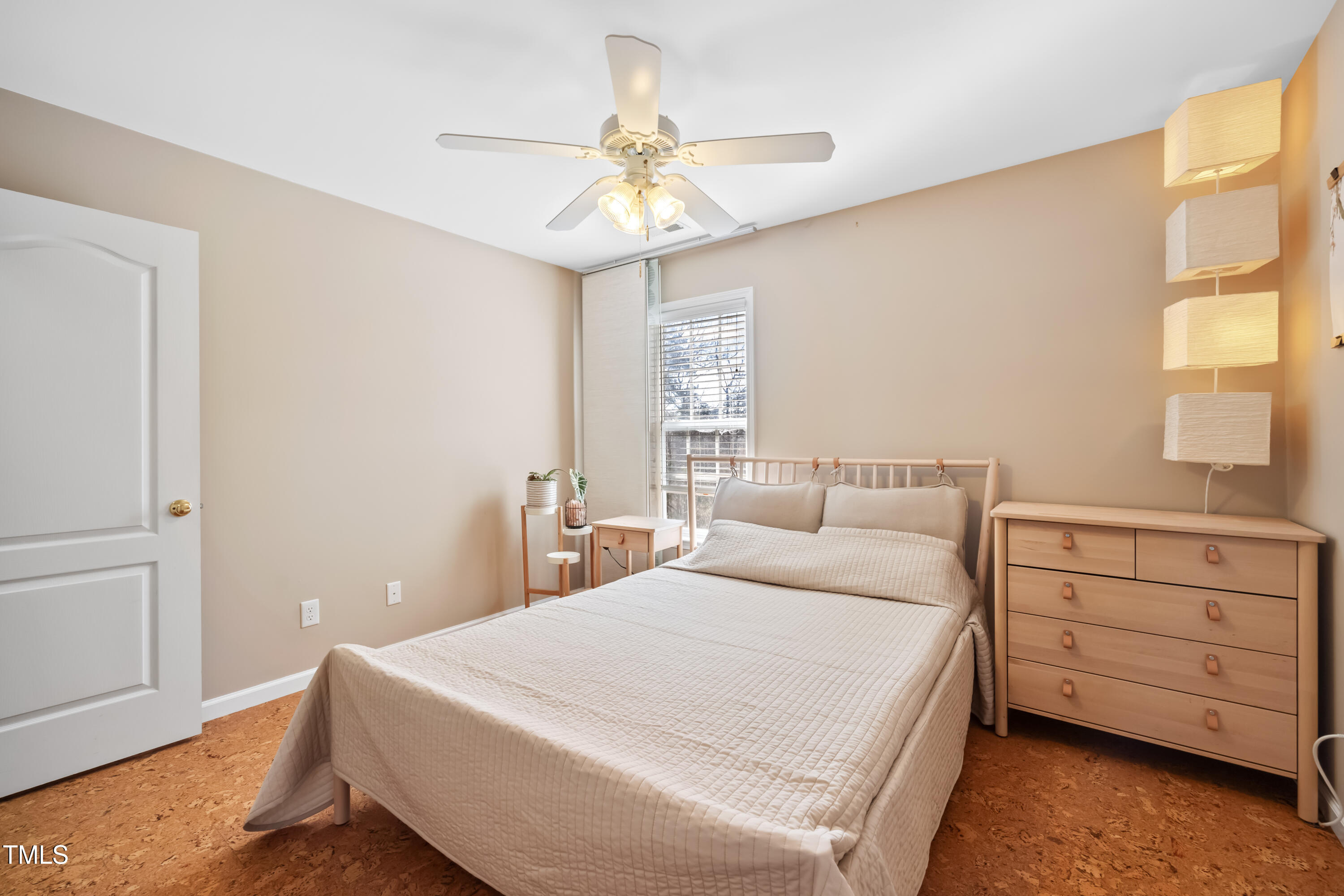 7772 Silver View Lane Raleigh, NC 27613 - Photo 25 of 55 a bedroom with a bed and a chandelier
