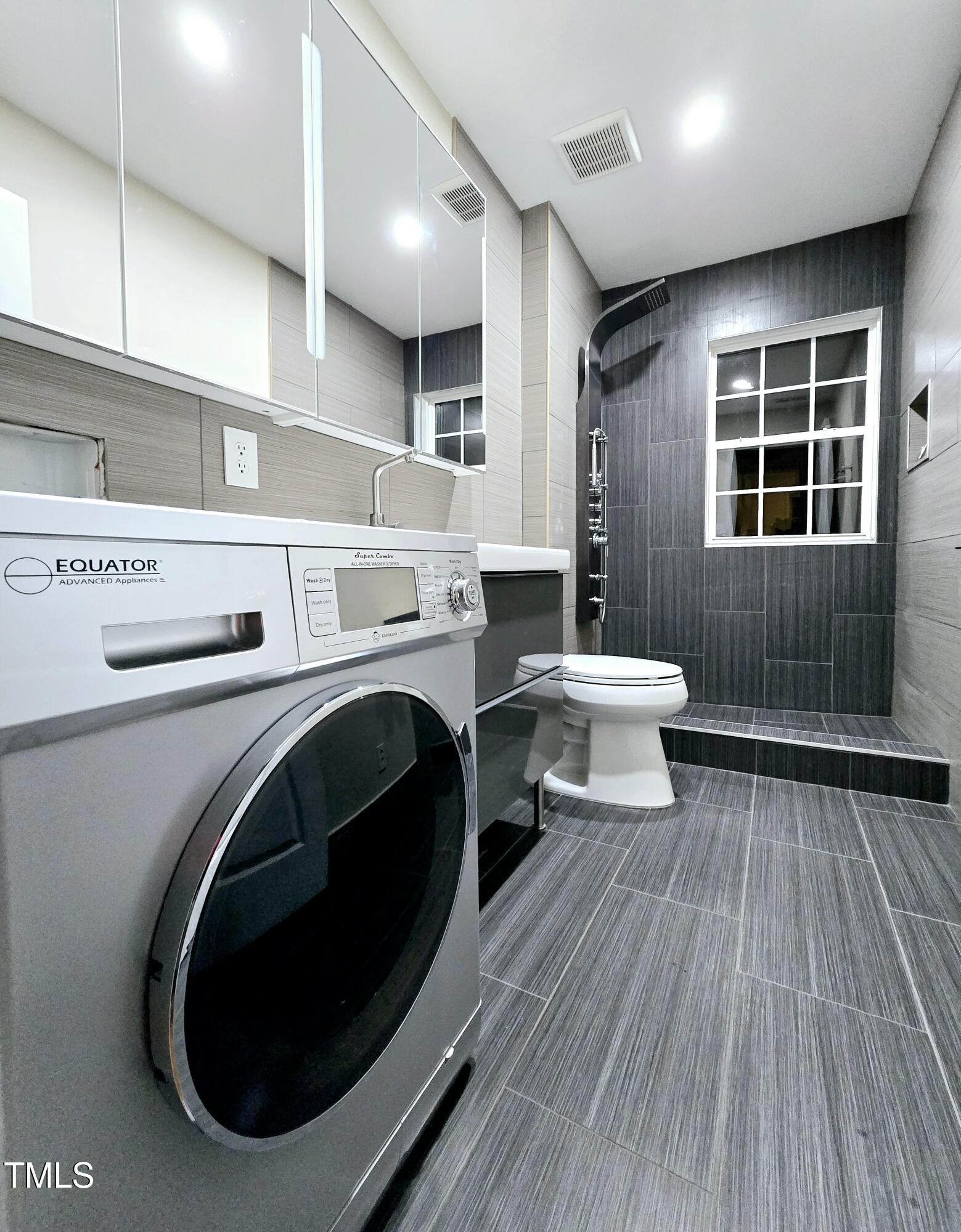 7772 Silver View Lane Raleigh, NC 27613 - Photo 28 of 55 a bathroom with a sink and a toilet