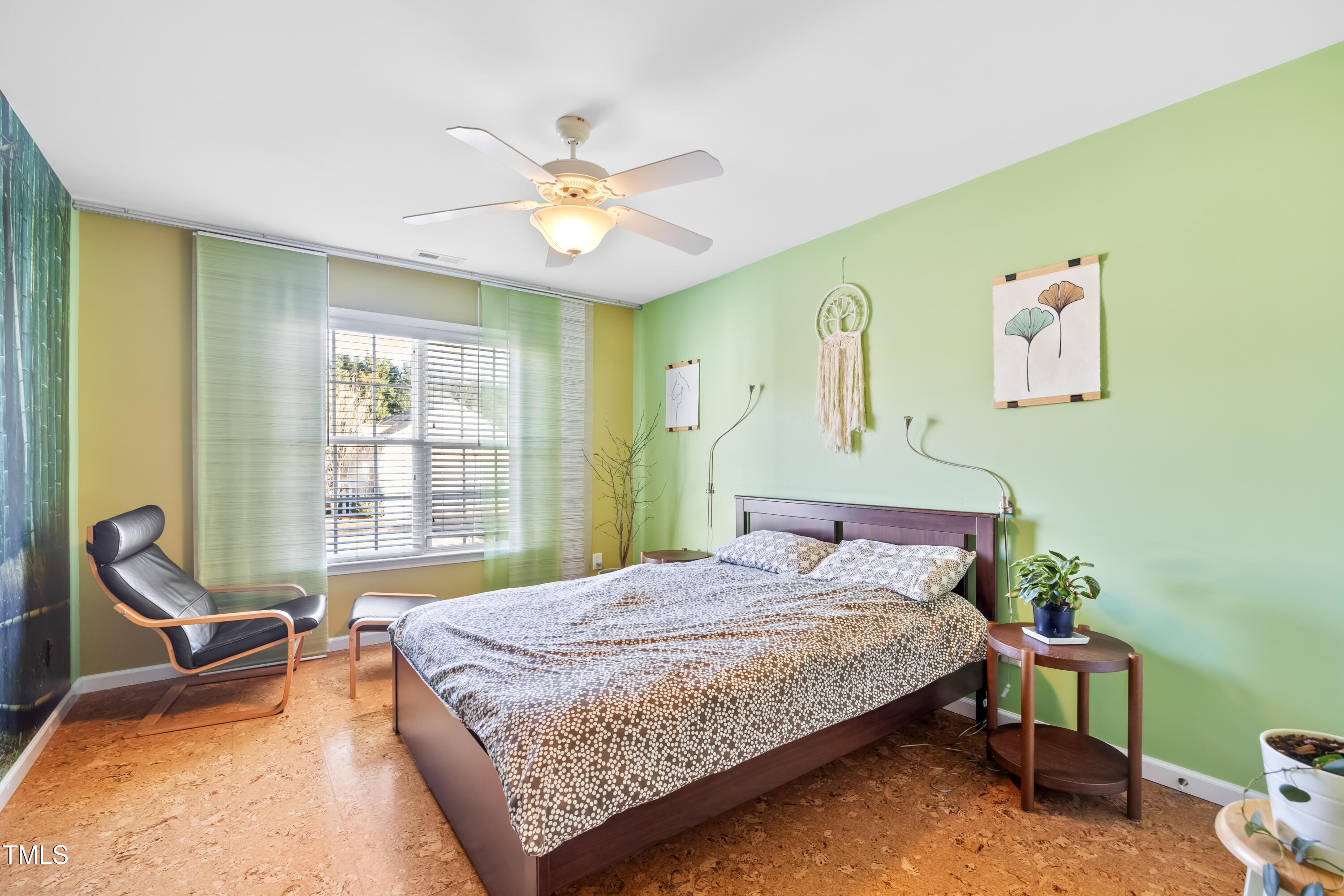 7772 Silver View Lane Raleigh, NC 27613 - Photo 30 of 55 a bedroom with a bed and a chair